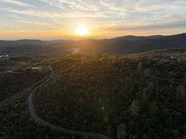 a view of a mountain from a yard