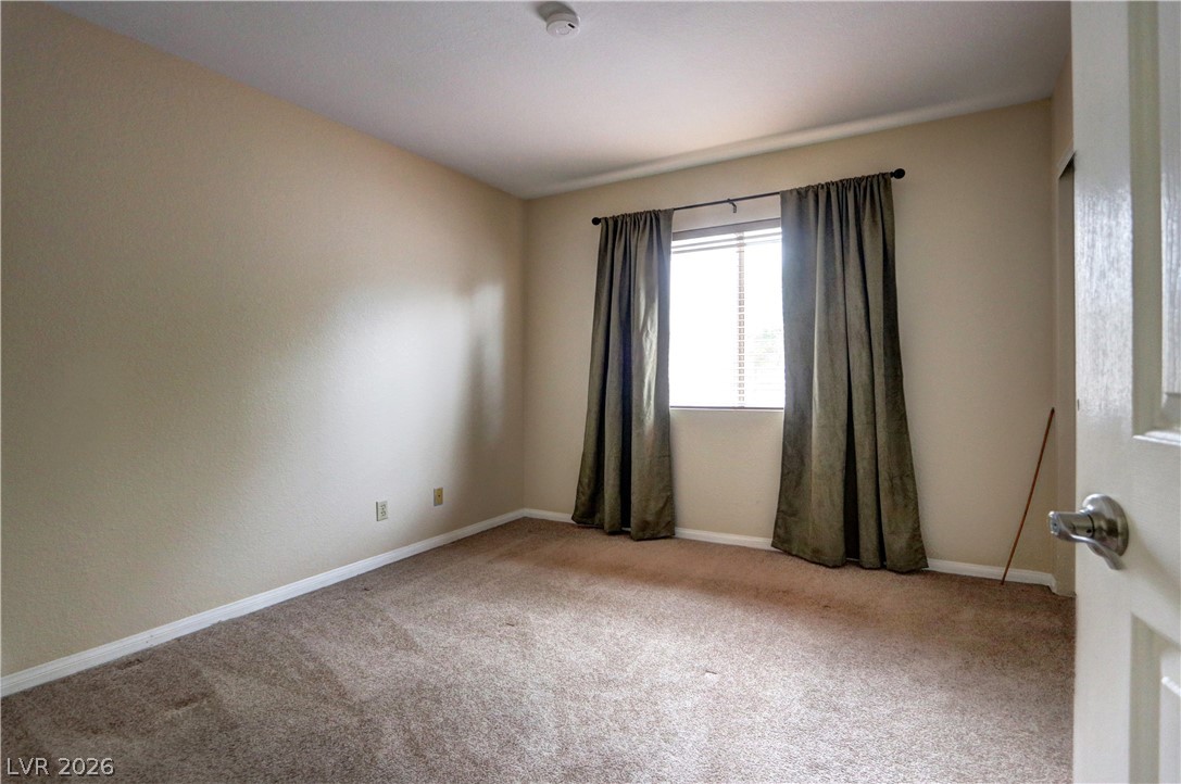 2108 Crestpoint Way Las Vegas, NV 89134 - Photo 20 of 27 Comfortable carpeted flooring and ample natural light fill this cozy private chamber.