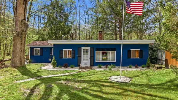 a front view of a house with yard