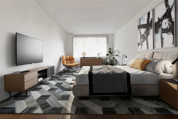 a bedroom with a bed and glass window