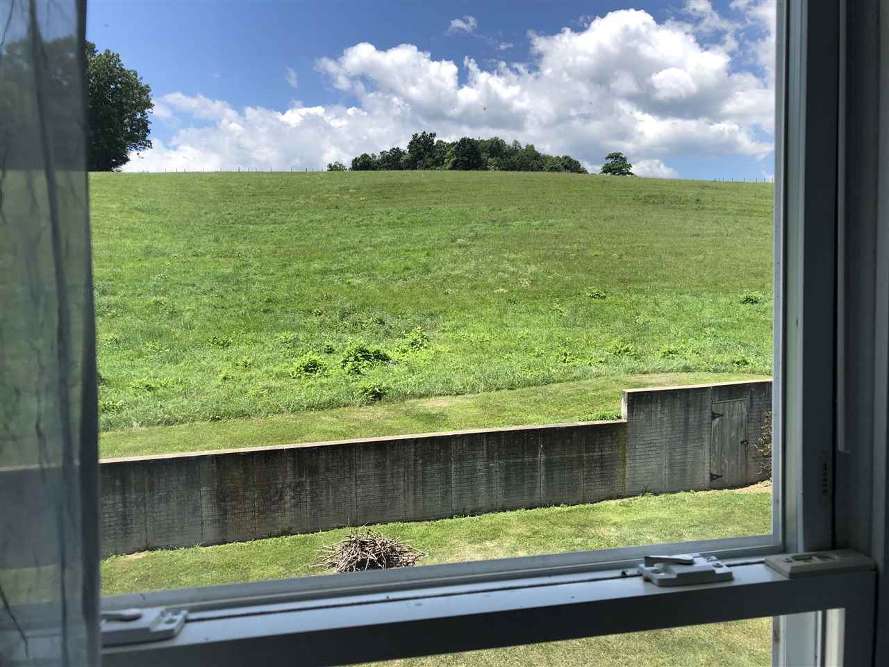 6945 Spring Creek Road Bridgewater, VA 22812 - Photo 13 of 37 a view of a yard from a window