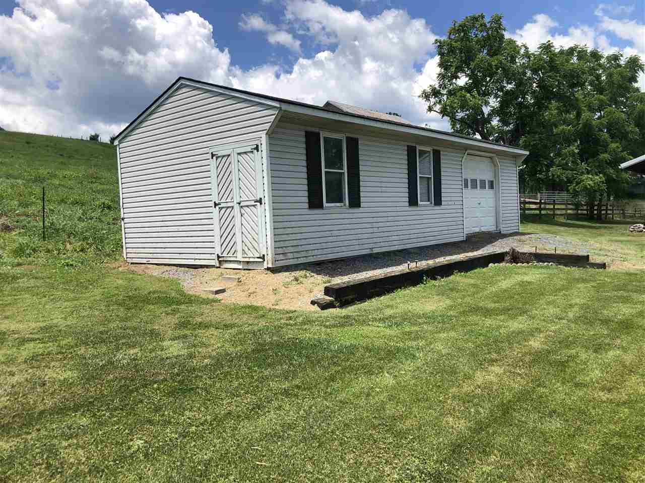 6945 Spring Creek Road Bridgewater, VA 22812 - Photo 30 of 37 a view of a house with a yard
