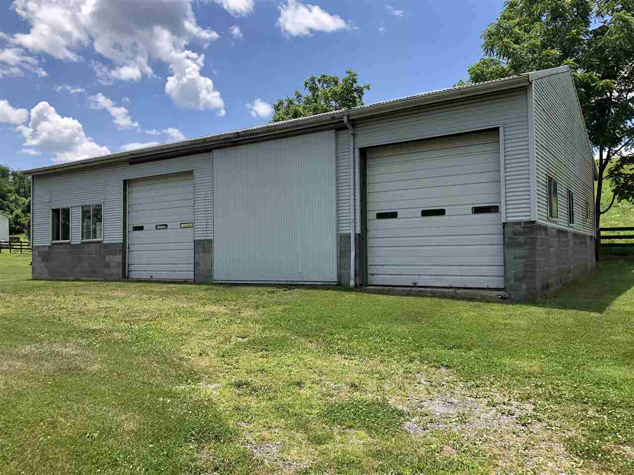 6945 Spring Creek Road Bridgewater, VA 22812 - Photo 3 of 37 a front view of a house with a garden