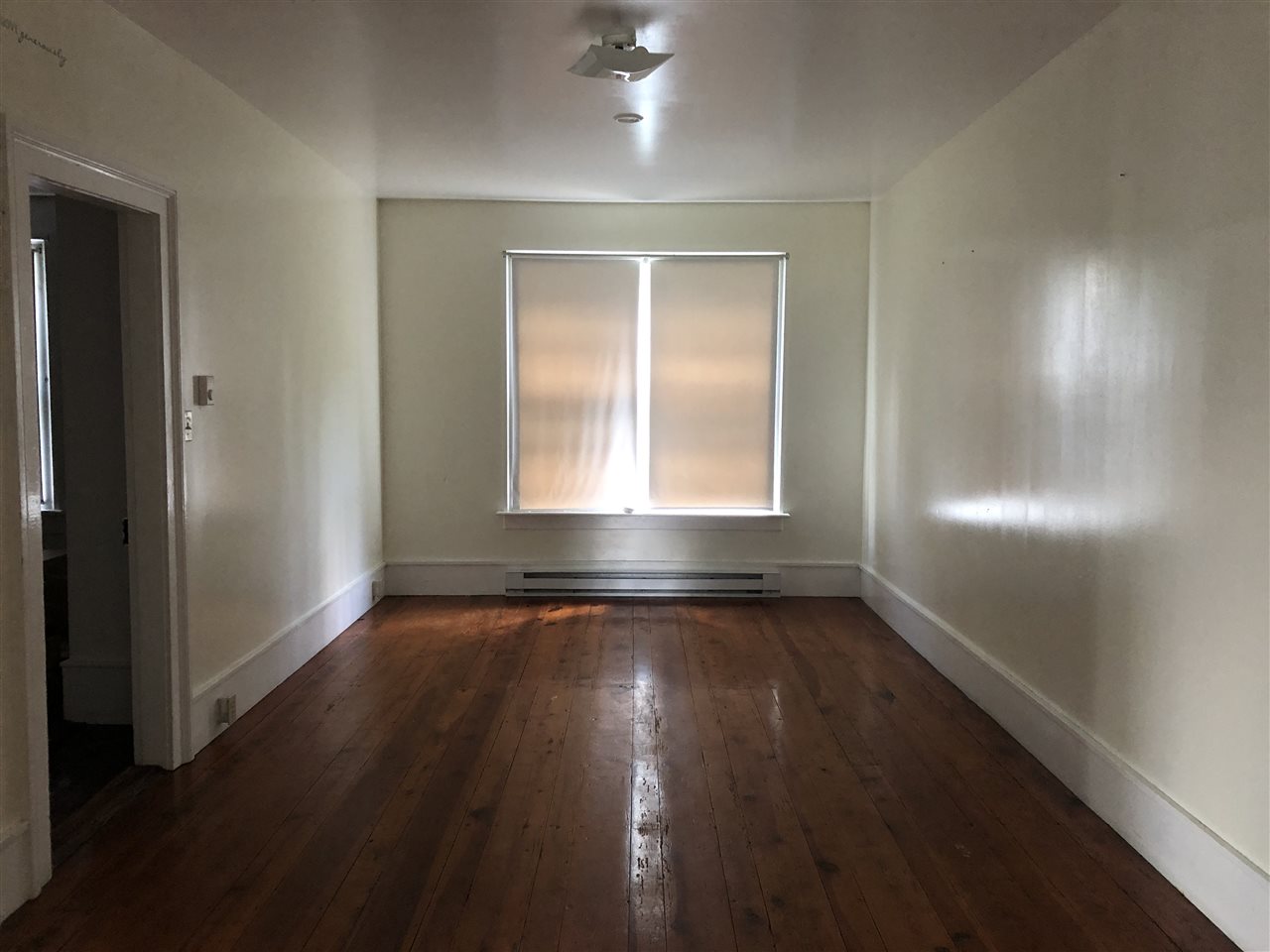 6945 Spring Creek Road Bridgewater, VA 22812 - Photo 9 of 37 an empty room with wooden floor and windows