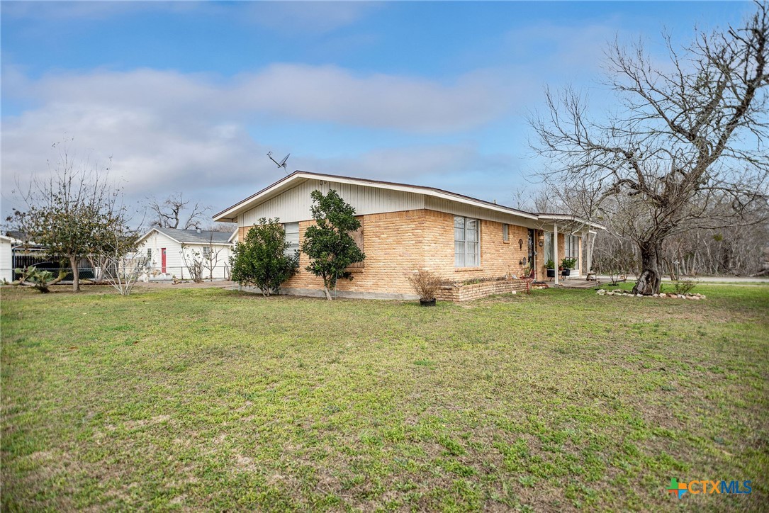 207 Williams Street Tivoli, TX 77990 - Photo 6 of 32 a front view of house with yard and green space