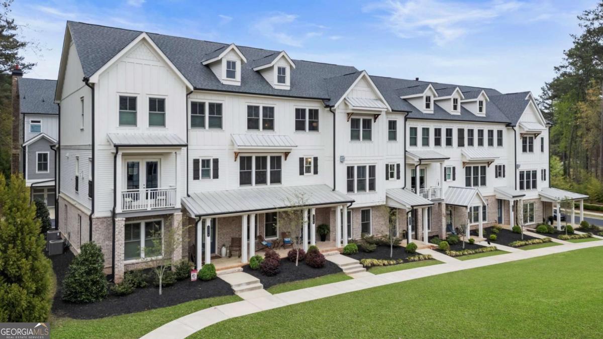 2068 Cortland Road Alpharetta, GA 30004 - Photo 1 of 1 a view of an apartment with a garden and patio