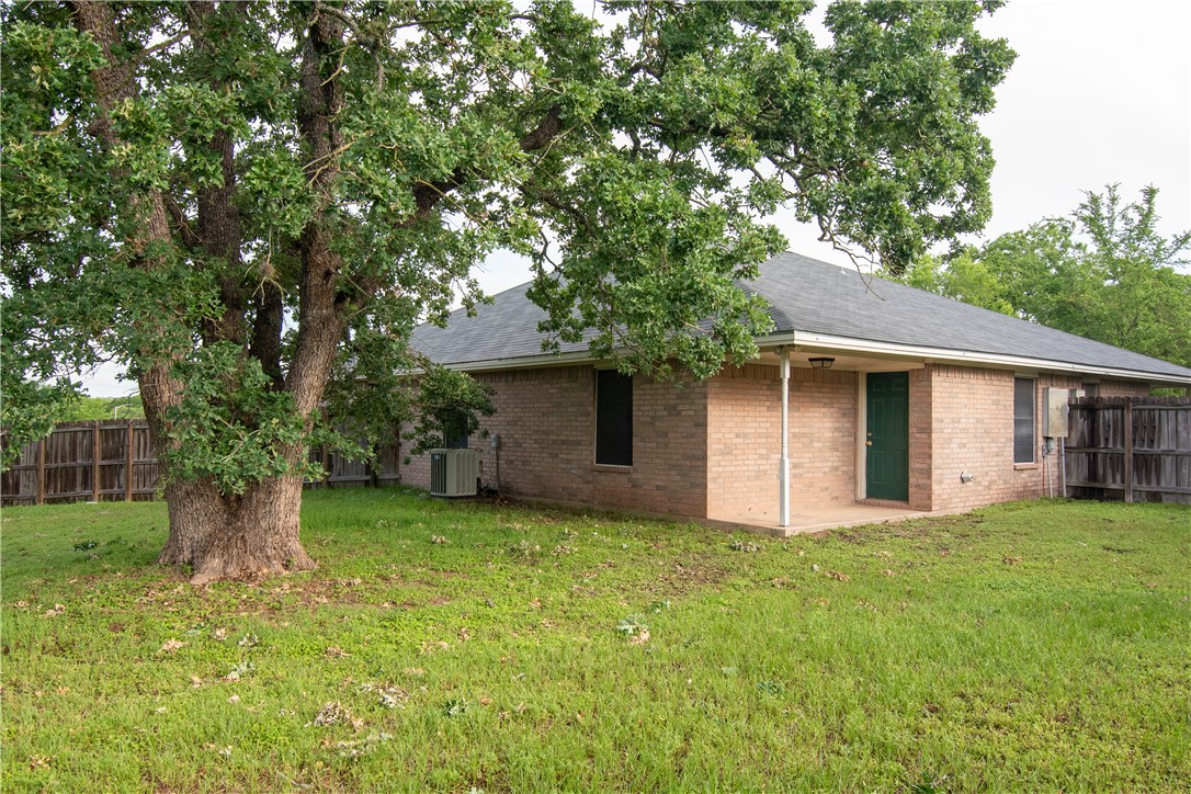 1735 Rock Hollow Loop Bryan, TX 77807 - Photo 24 of 25 front view of a house with a yard
