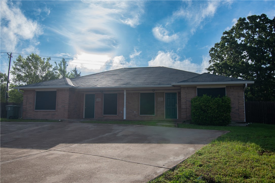 1735 Rock Hollow Loop Bryan, TX 77807 - Photo 25 of 25 front view of a house with a yard