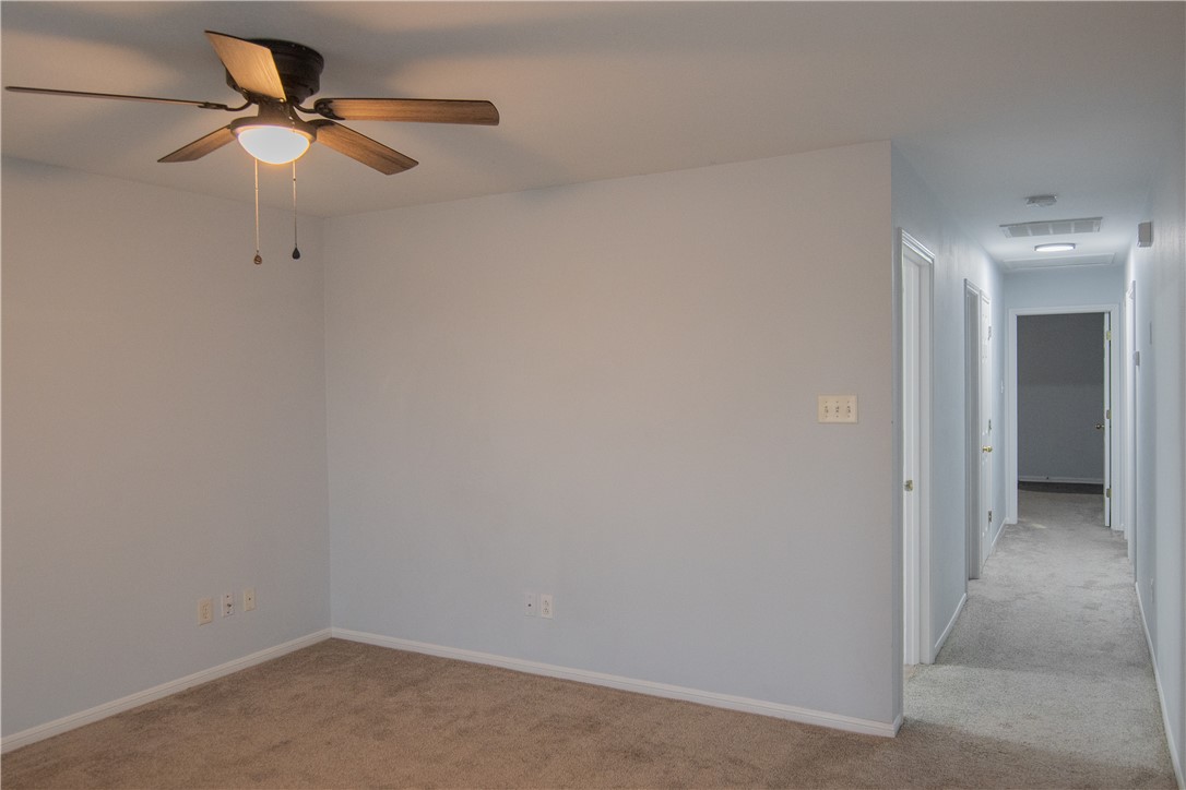 1735 Rock Hollow Loop Bryan, TX 77807 - Photo 10 of 25 a view of a livingroom with a ceiling fan and closet