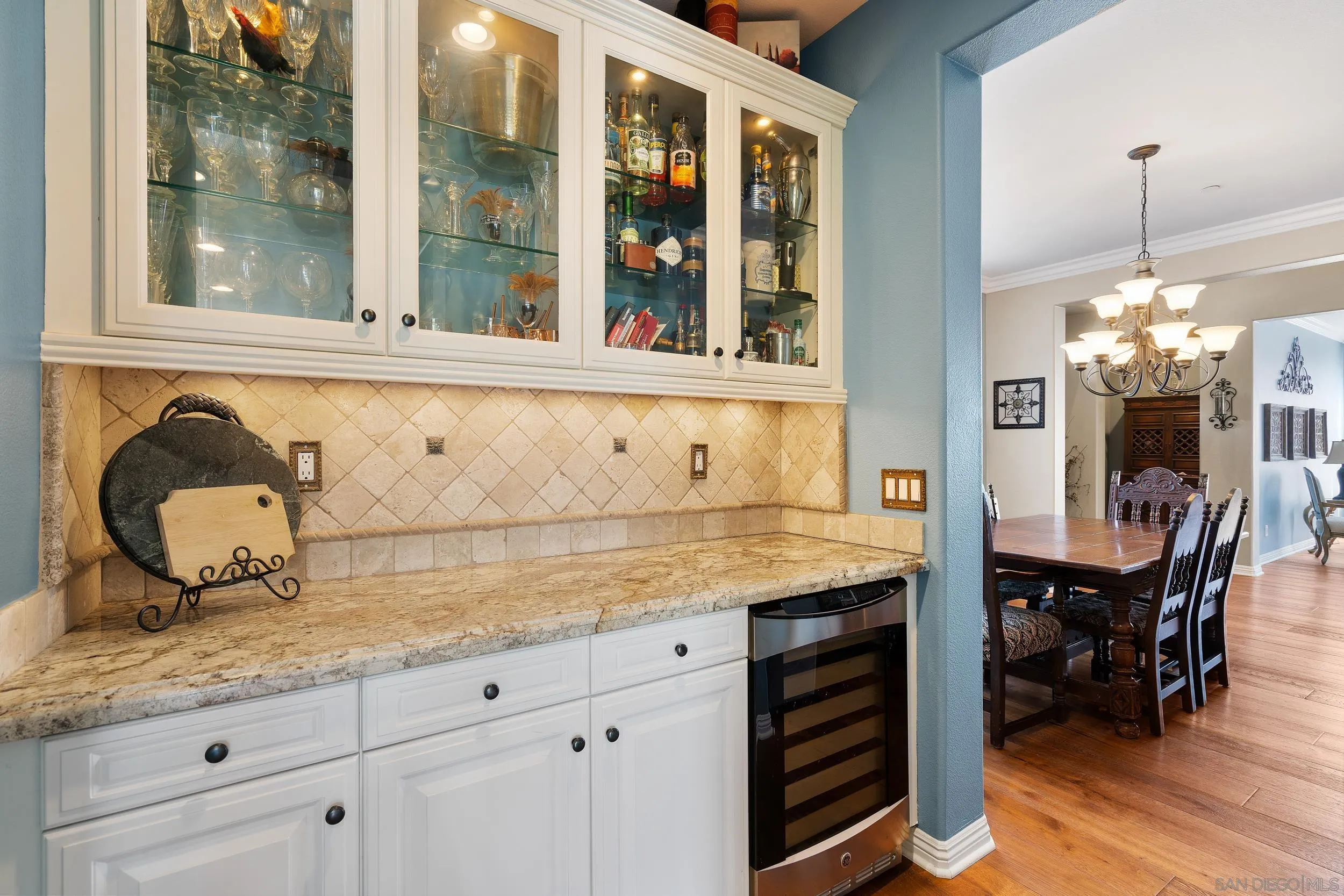 15976 Cayenne Ridge Road San Diego, CA 92127 - Photo 11 of 32 a living room with granite countertop furniture and a floor to ceiling window