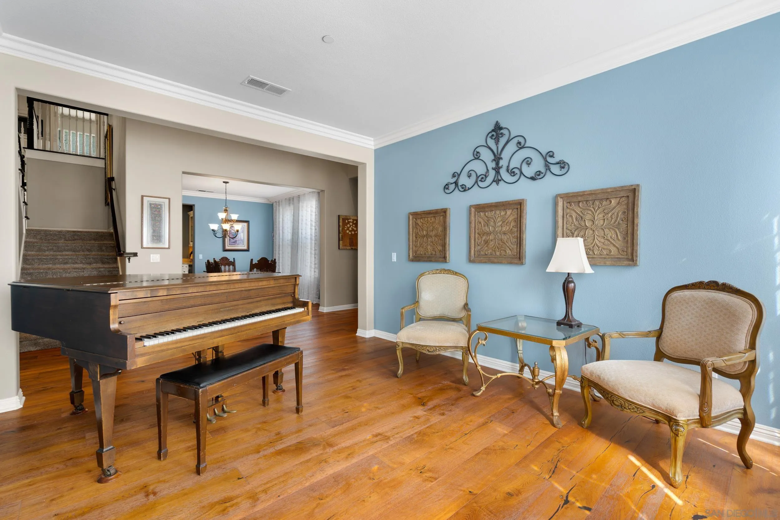 15976 Cayenne Ridge Road San Diego, CA 92127 - Photo 13 of 32 a living room with furniture and wooden floor