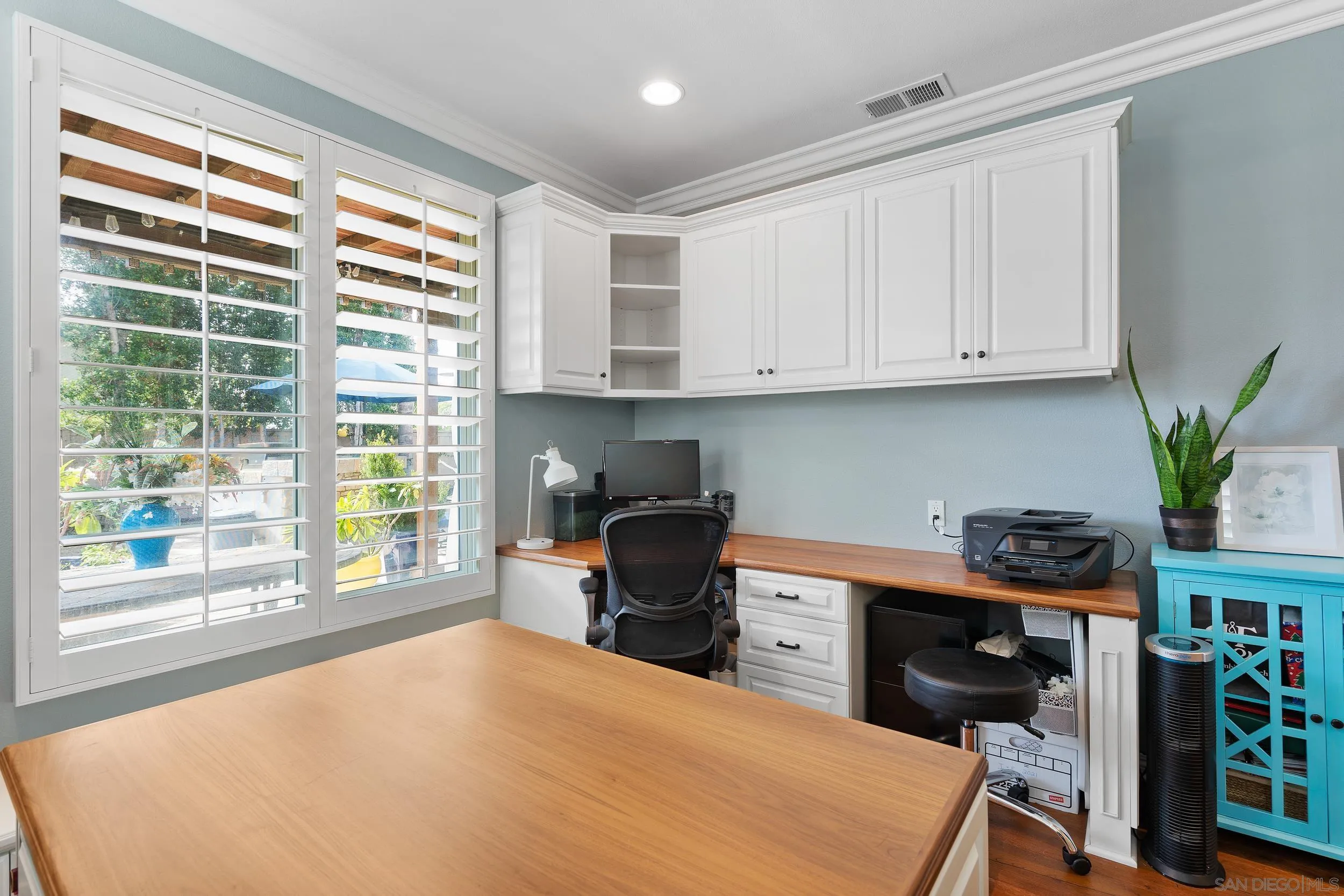 15976 Cayenne Ridge Road San Diego, CA 92127 - Photo 15 of 32 a kitchen with stainless steel appliances a stove a sink a cabinets and a window