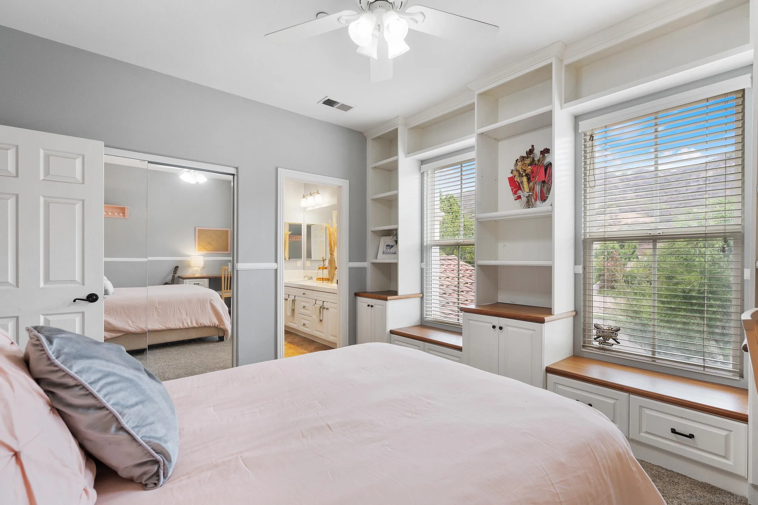 15976 Cayenne Ridge Road San Diego, CA 92127 - Photo 17 of 32 a bedroom with a bed and a large window