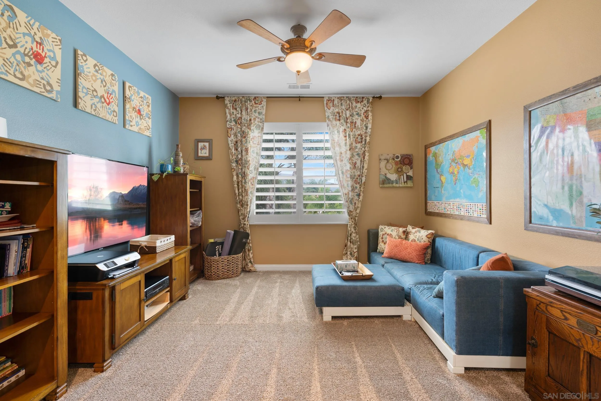 15976 Cayenne Ridge Road San Diego, CA 92127 - Photo 23 of 32 a living room with furniture and a flat screen tv