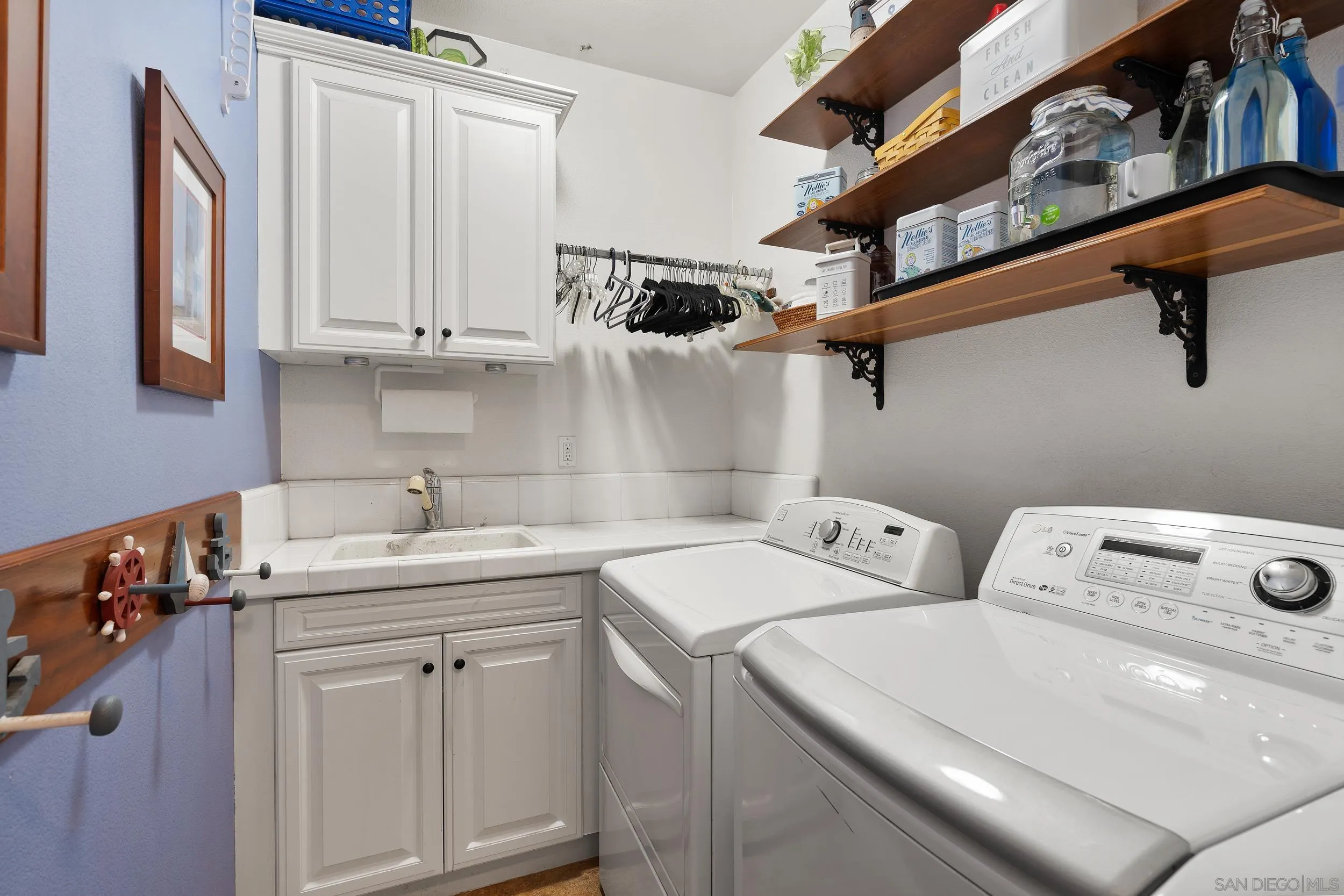 15976 Cayenne Ridge Road San Diego, CA 92127 - Photo 25 of 32 a utility room with dryer and washer