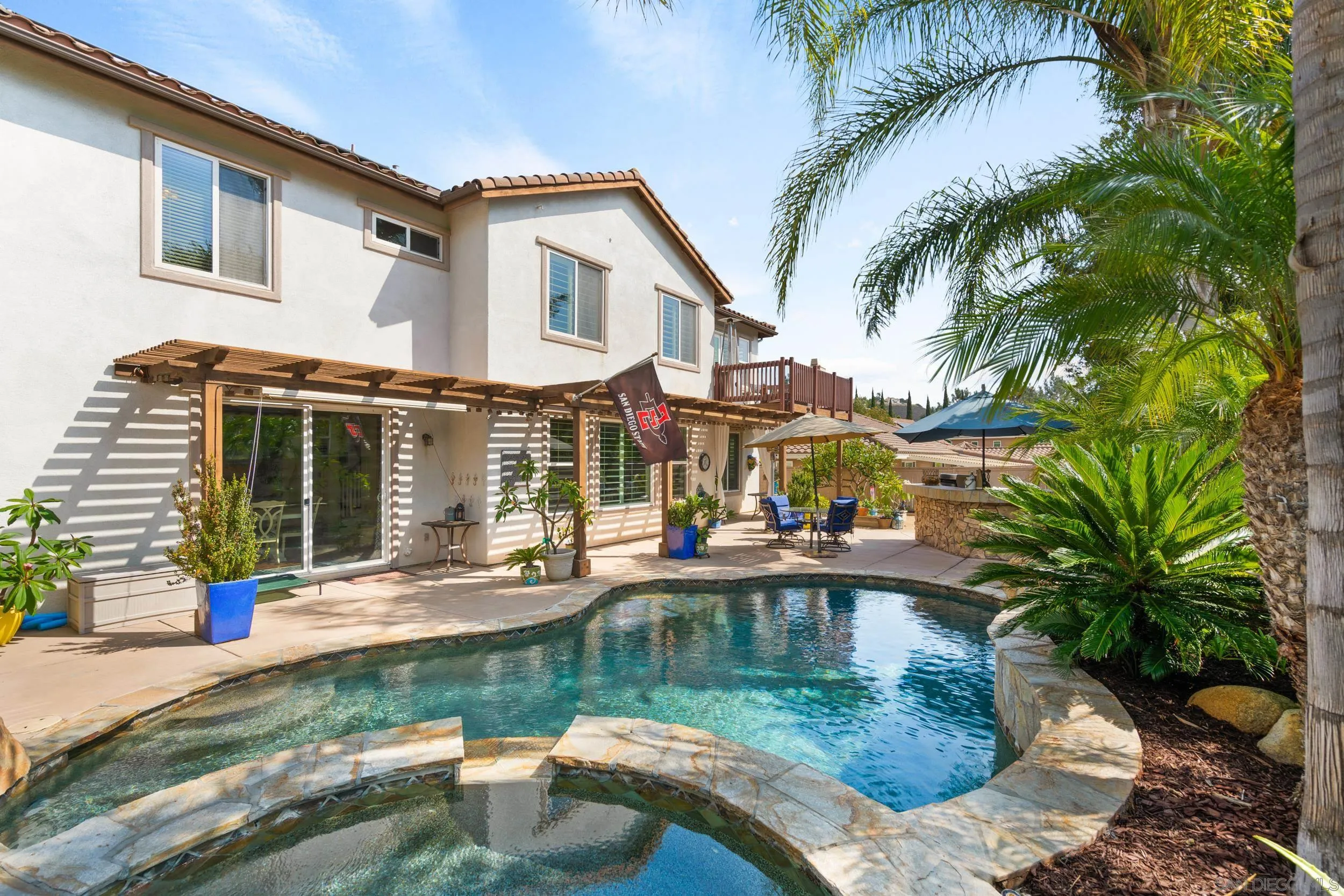 15976 Cayenne Ridge Road San Diego, CA 92127 - Photo 26 of 32 a view of house with swimming pool and a yard