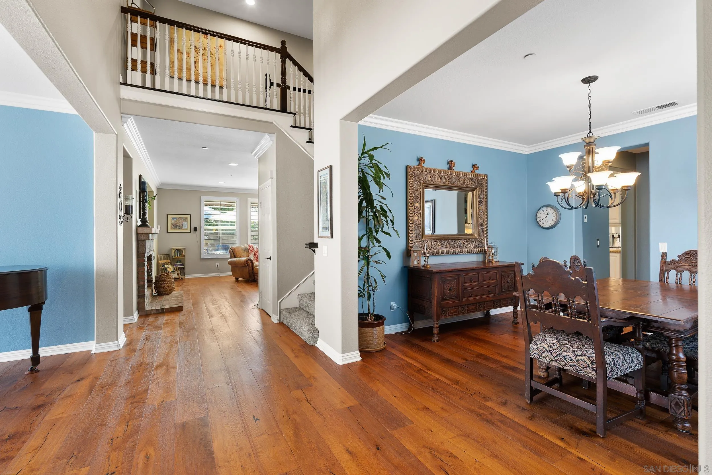 15976 Cayenne Ridge Road San Diego, CA 92127 - Photo 4 of 32 a view of a livingroom with furniture wooden floor and a chandelier