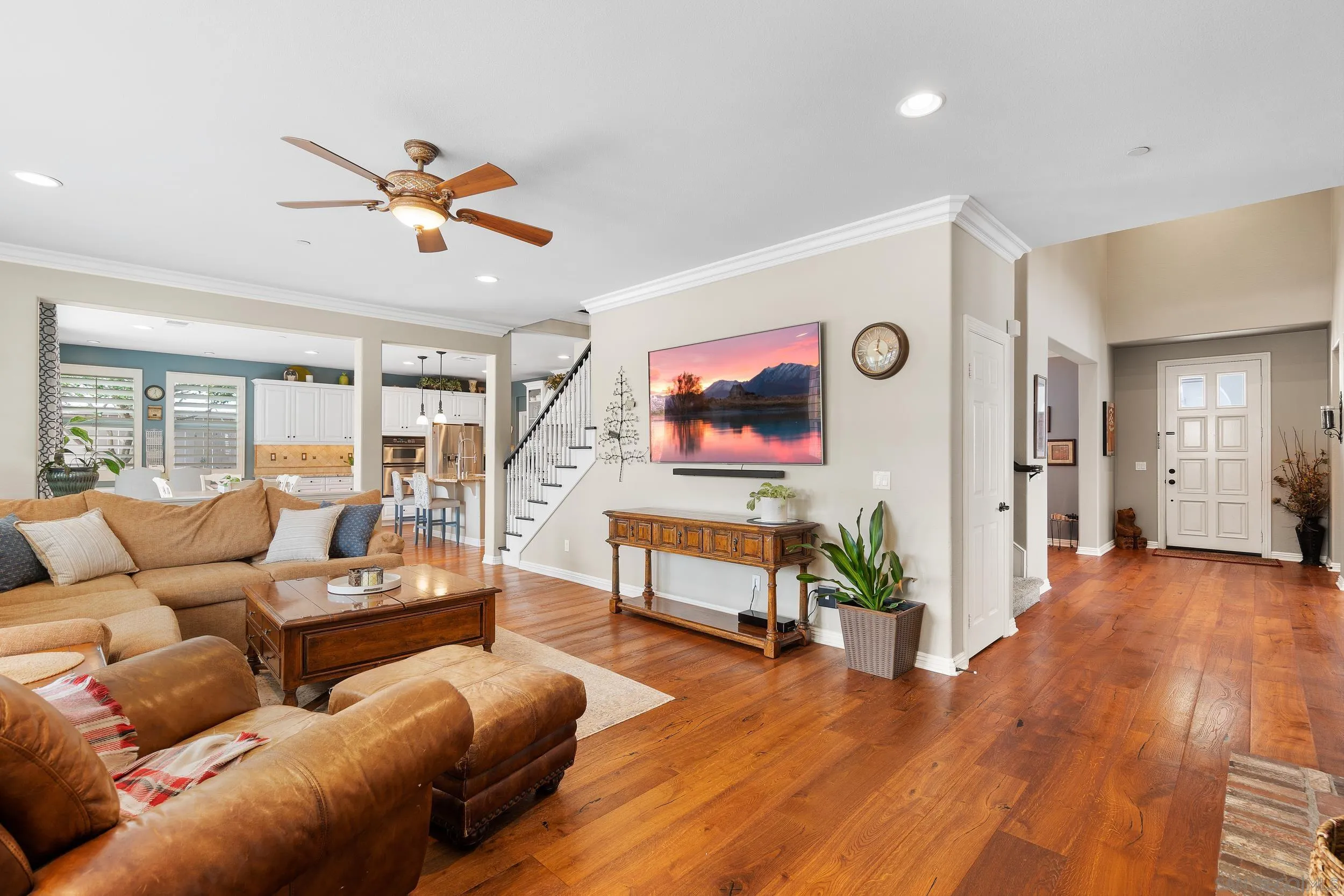 15976 Cayenne Ridge Road San Diego, CA 92127 - Photo 6 of 32 a living room with furniture and wooden floor