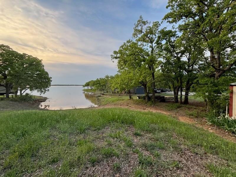 1429 Casino Road Nocona, TX 76255 - Photo 1 of 18 a view of a park with large trees