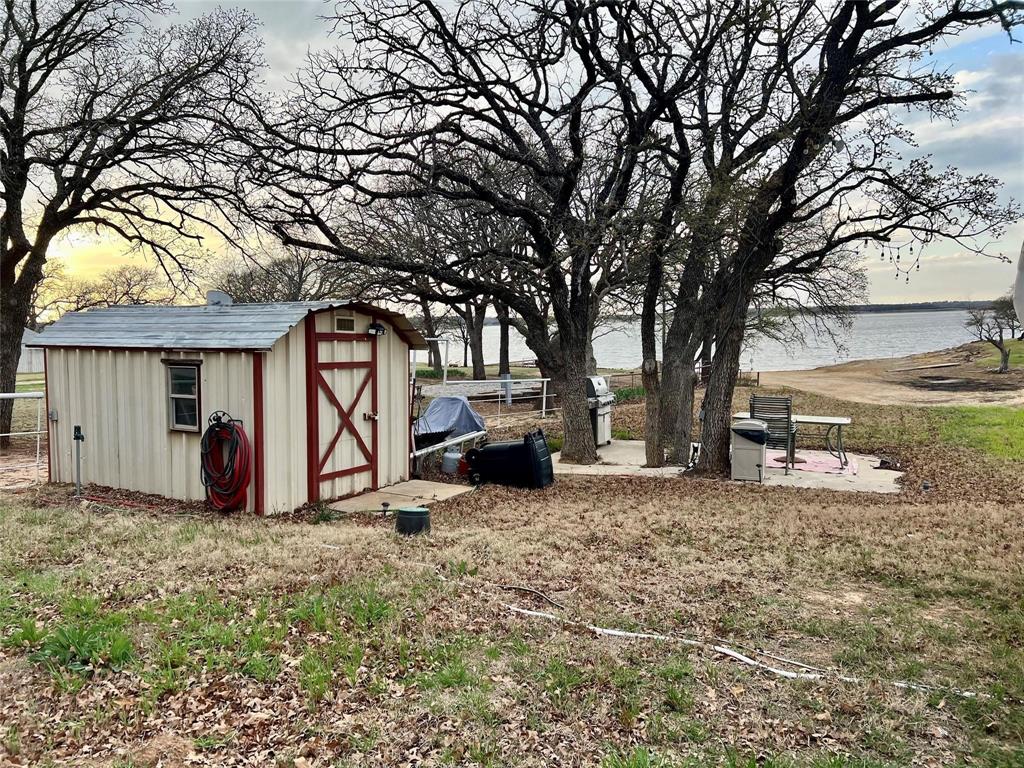 1429 Casino Road Nocona, TX 76255 - Photo 14 of 18 a view of a house with a yard