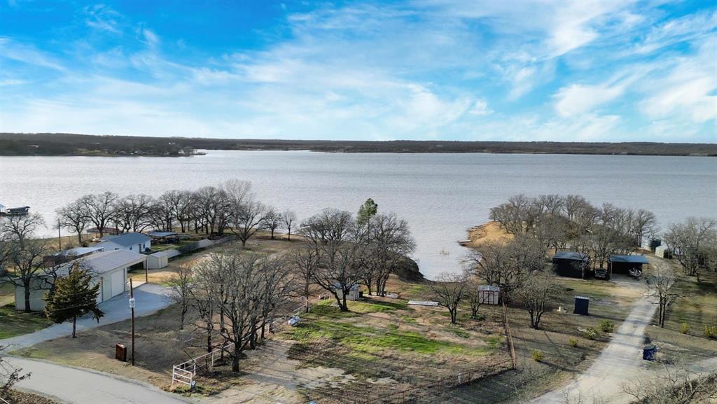 1429 Casino Road Nocona, TX 76255 - Photo 9 of 18 a view of a lake with outdoor space