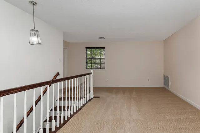 a view of empty room with windows