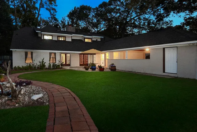 a view of a big yard with potted plants