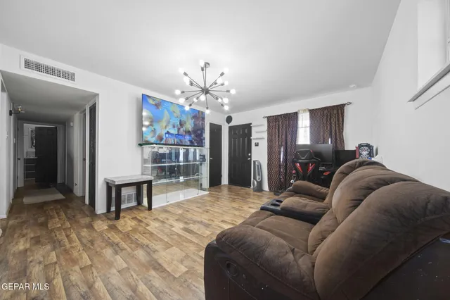 a bed room with a bed mirror and a desk