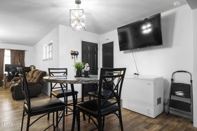a view of a livingroom with furniture and a flat screen tv