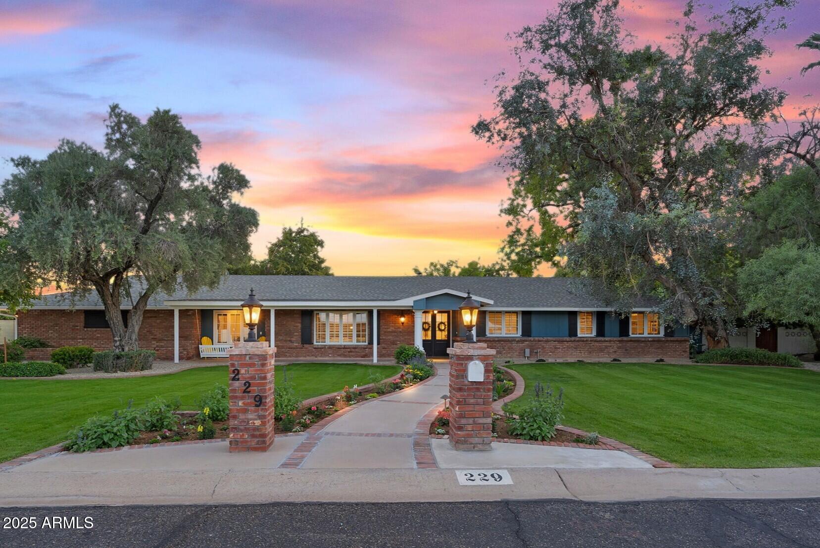 229 West Berridge Lane Phoenix, AZ 85013 - Photo 1 of 78 a front view of a house with a yard