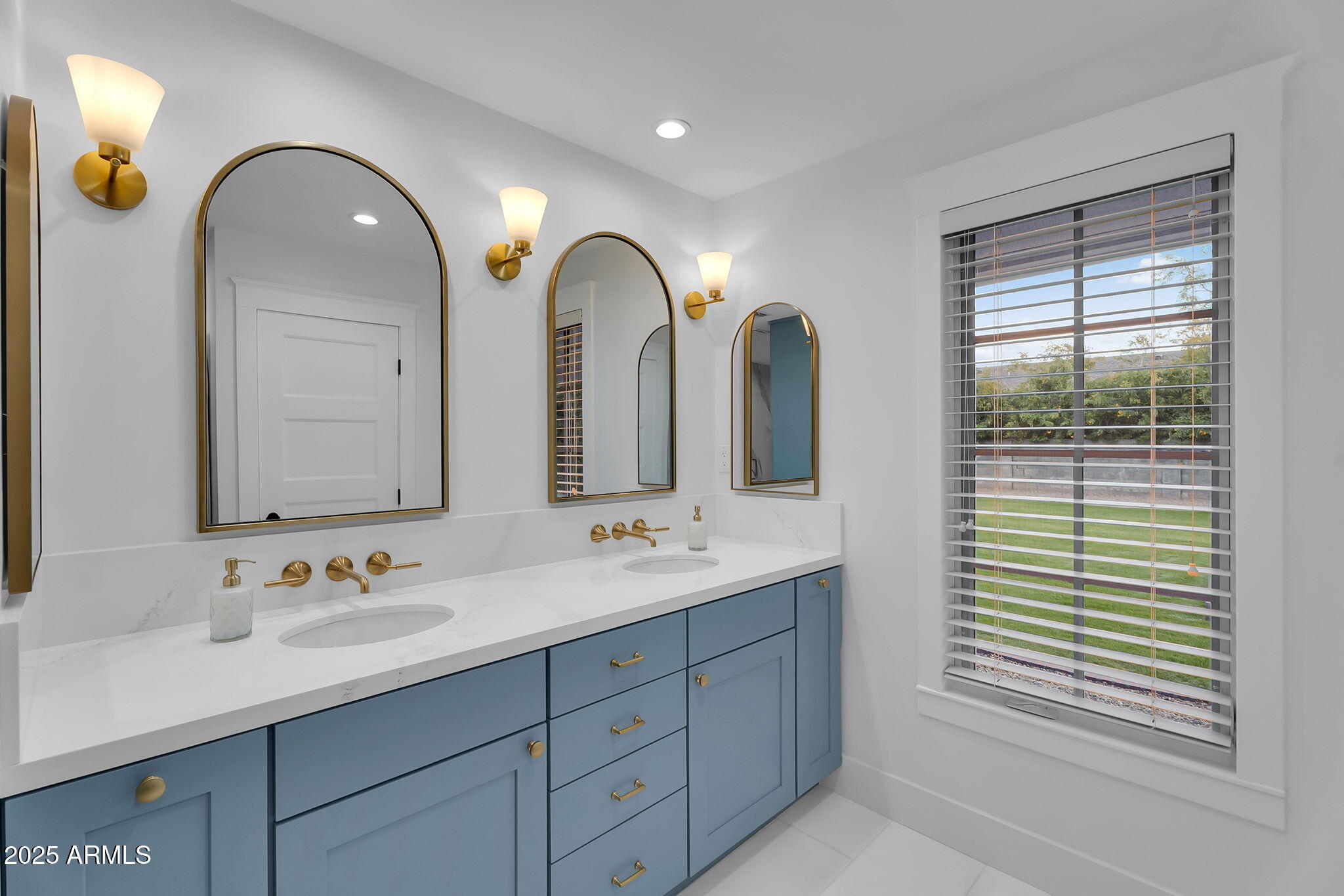 229 West Berridge Lane Phoenix, AZ 85013 - Photo 27 of 78 a bathroom with 2 sink and a large mirror