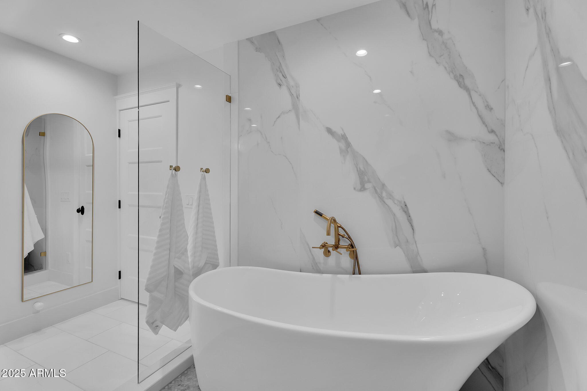 229 West Berridge Lane Phoenix, AZ 85013 - Photo 30 of 78 a white bath tub sitting in a bathroom and shower