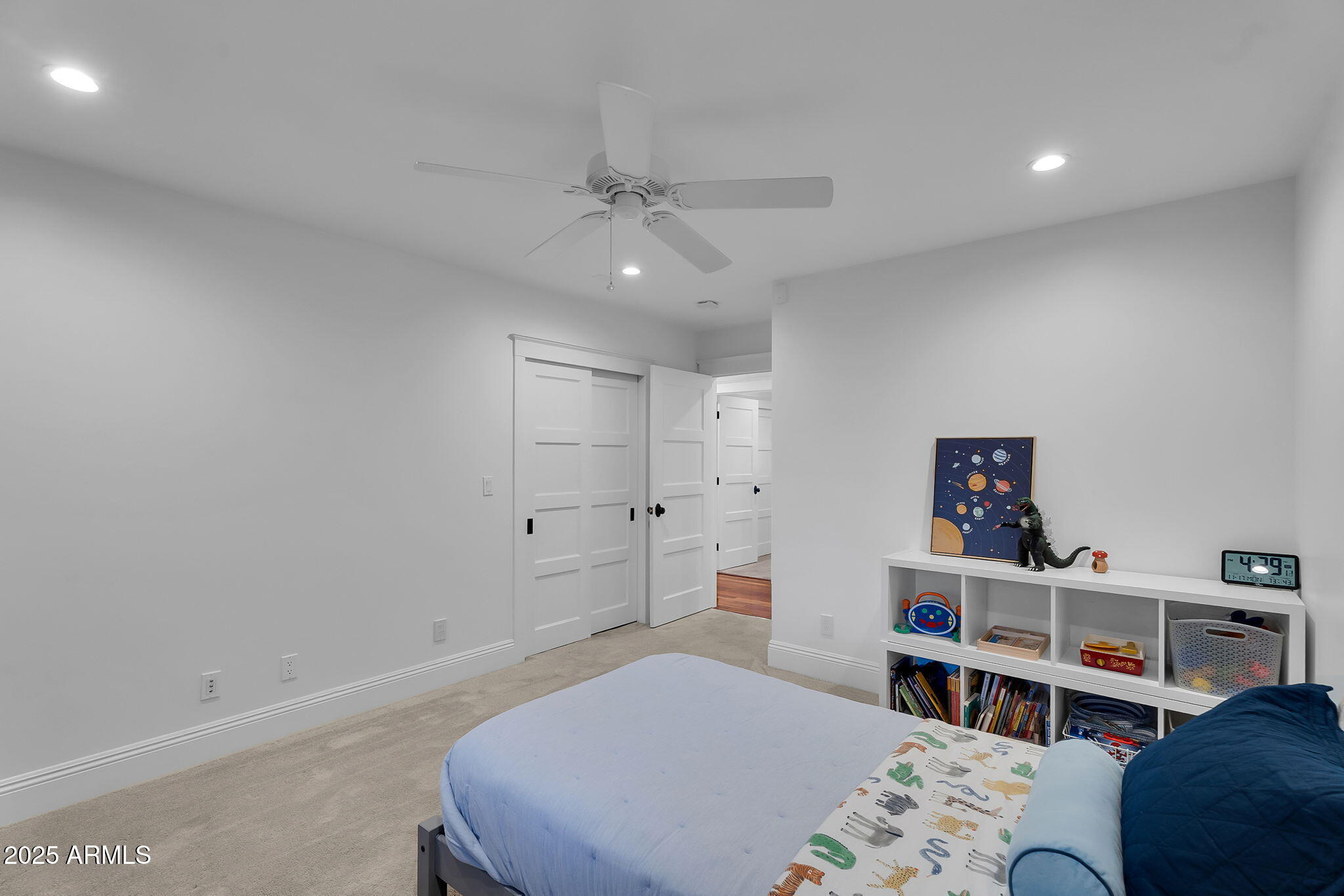 229 West Berridge Lane Phoenix, AZ 85013 - Photo 36 of 78 a bedroom with a bed and a book shelf