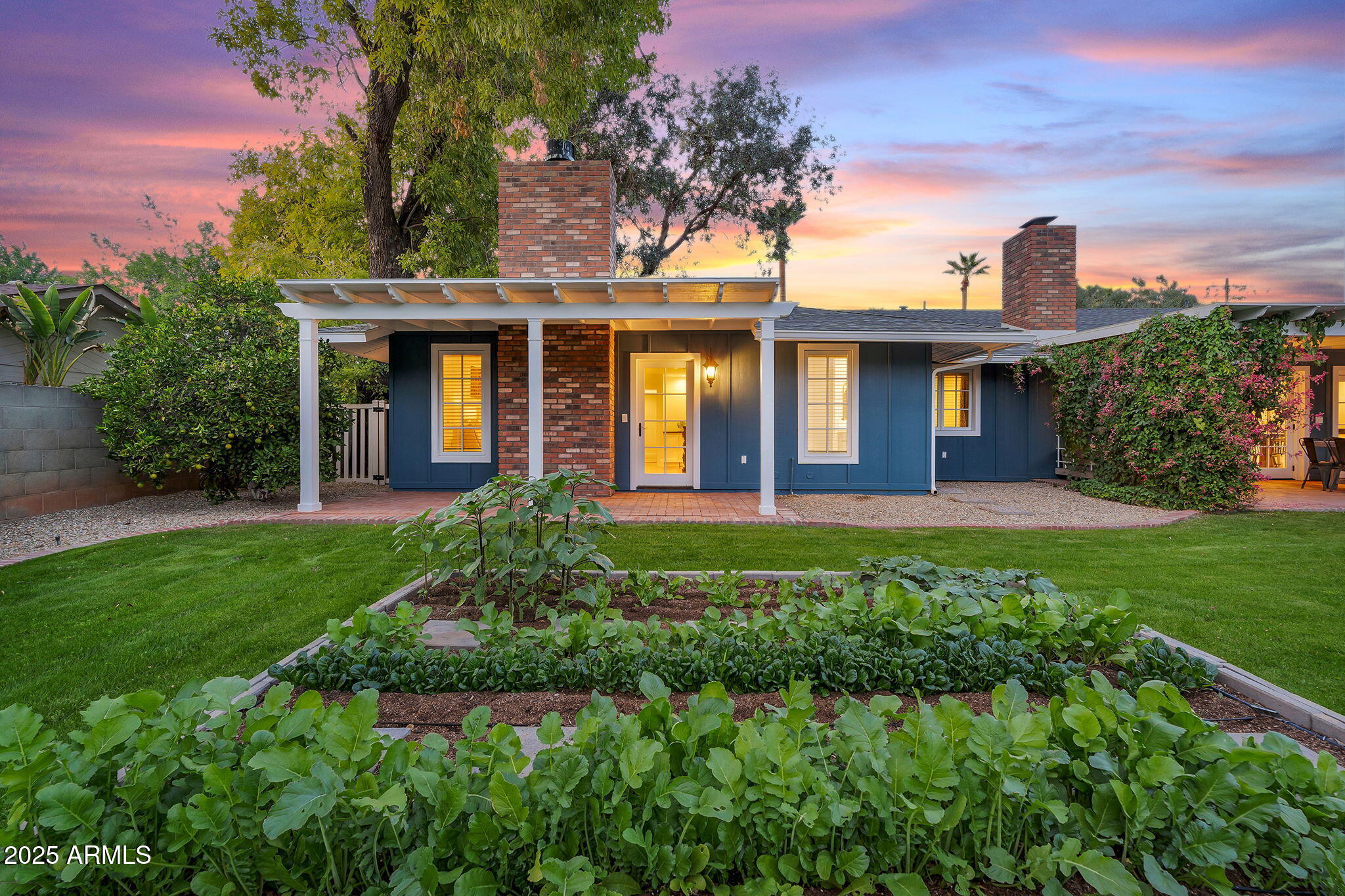 229 West Berridge Lane Phoenix, AZ 85013 - Photo 64 of 78 a front view of a house with a garden