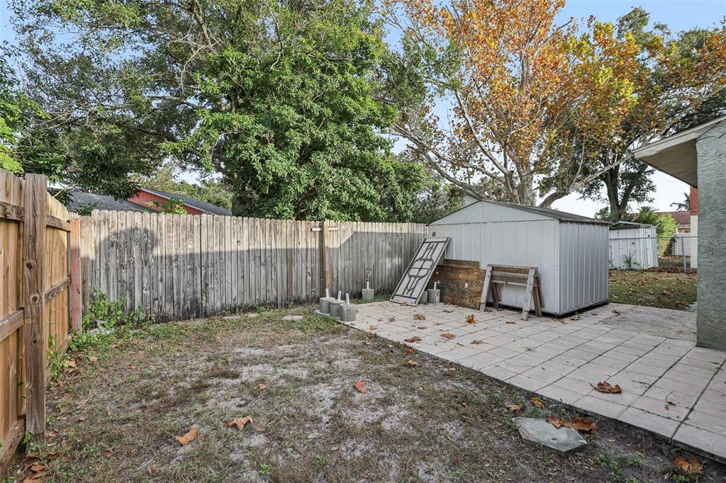 5575 58th Street North Kenneth City, FL 33709 - Photo 27 of 31 a view of a backyard with a tree