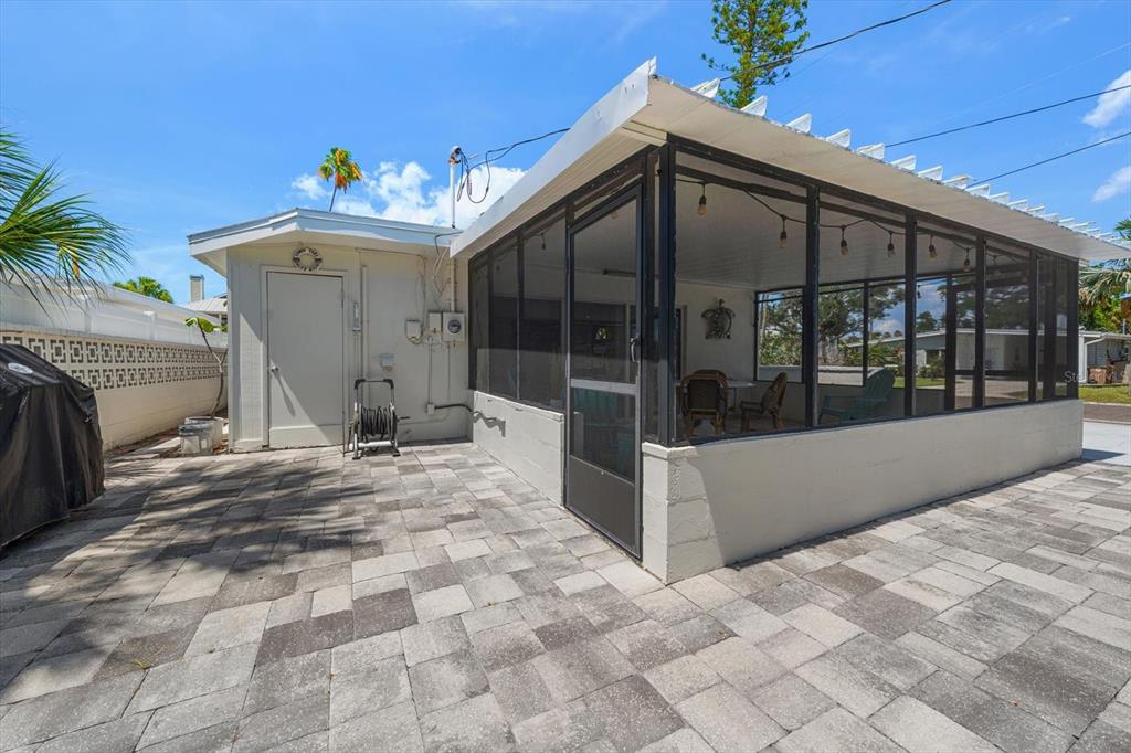127 11th Avenue Indian Rocks Beach, FL 33785 - Photo 30 of 63 a view of a porch with a chandelier