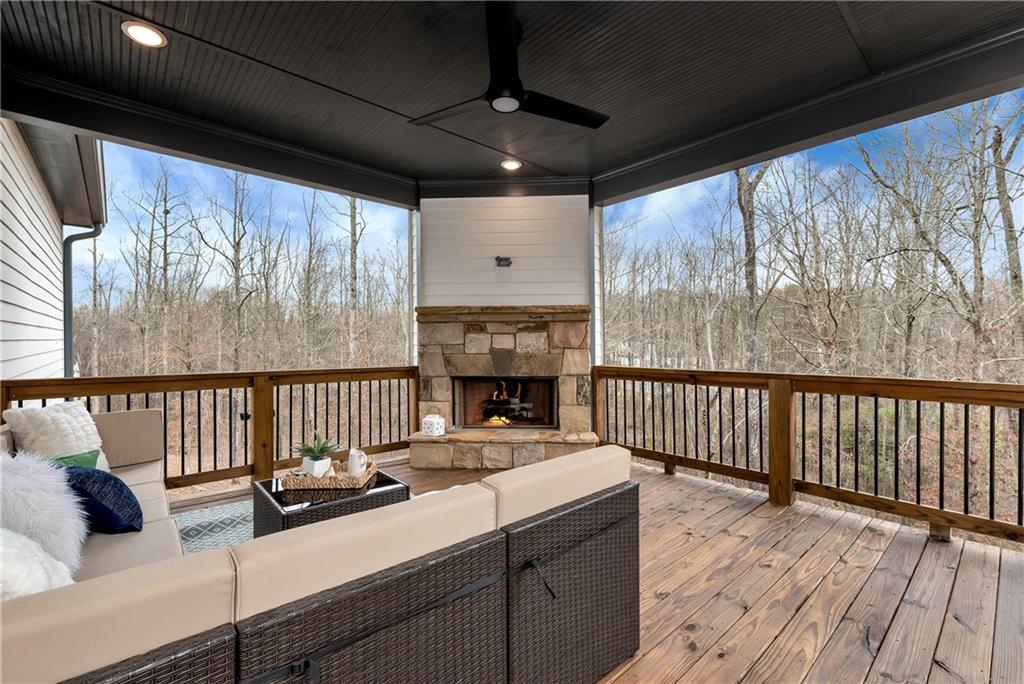 6140 Crescent Moon Ridge Cumming, GA 30041 - Photo 24 of 54 a room with furniture and a fireplace