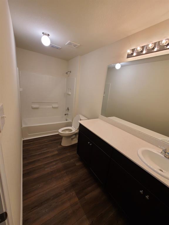 4009 Renee Drive Dallas, TX 75227 - Photo 11 of 15 a bathroom with a sink and a mirror