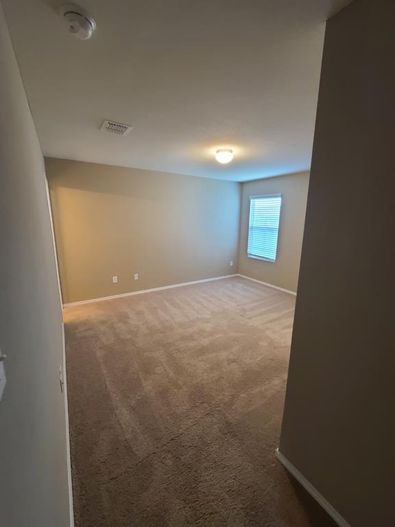 4009 Renee Drive Dallas, TX 75227 - Photo 13 of 15 an empty room with windows