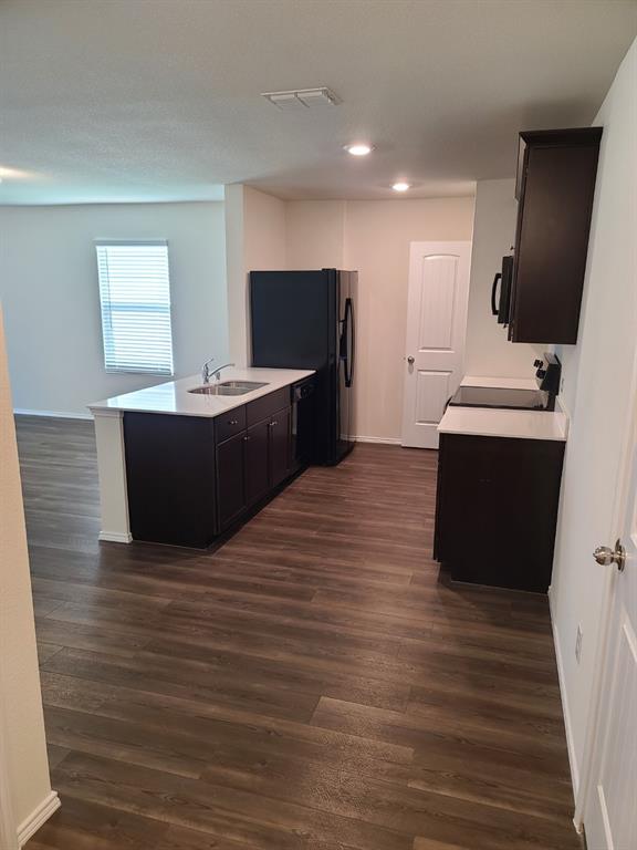 4009 Renee Drive Dallas, TX 75227 - Photo 3 of 15 a living room with stainless steel appliances furniture and a flat screen tv
