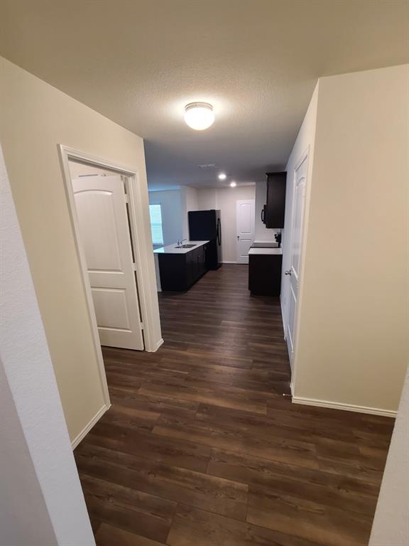 4009 Renee Drive Dallas, TX 75227 - Photo 5 of 15 a view of a kitchen from a hallway