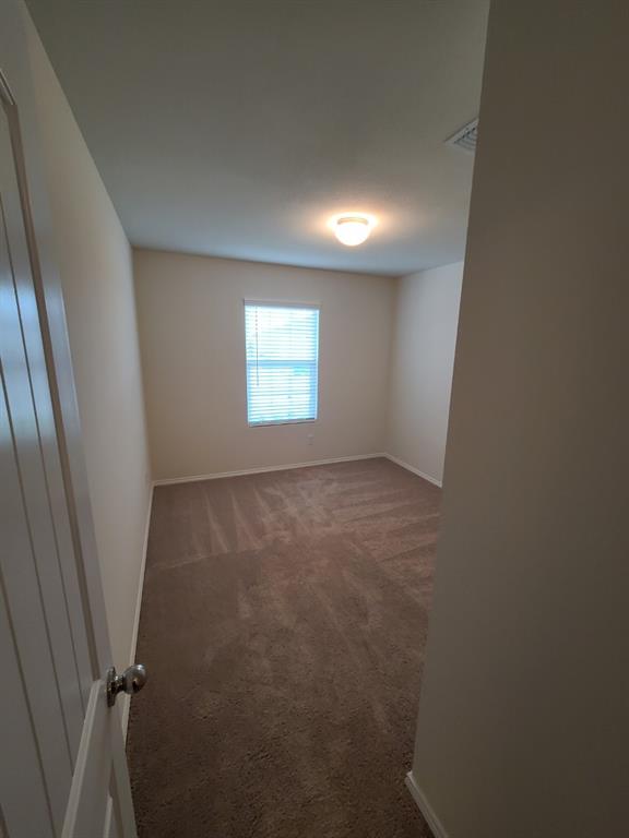 4009 Renee Drive Dallas, TX 75227 - Photo 10 of 15 an empty room with windows