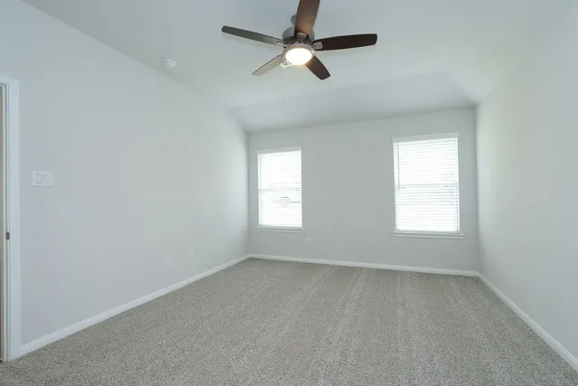 a kitchen with granite countertop stainless steel appliances a stove sink microwave and cabinets