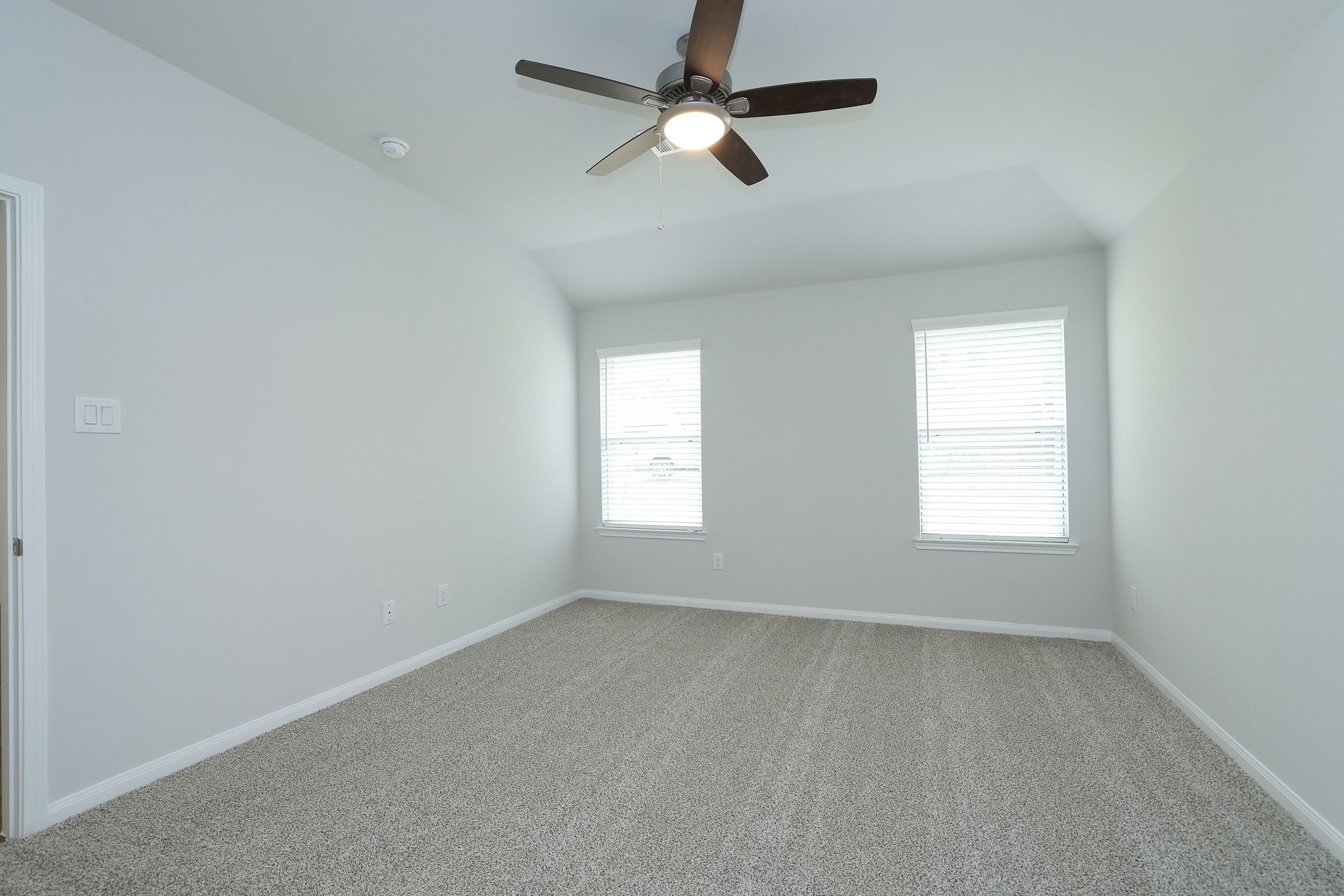 26439 Lake Shore Drive Hempstead, TX 77445 - Photo 14 of 45 an empty room with a window and a fan