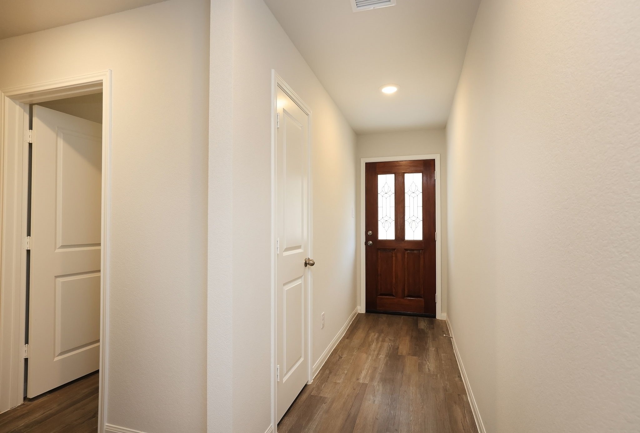 26439 Lake Shore Drive Hempstead, TX 77445 - Photo 26 of 45 a view of a hallway with wooden floor and closet
