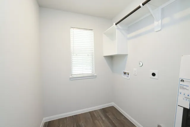a view of a hallway with wooden floor and closet