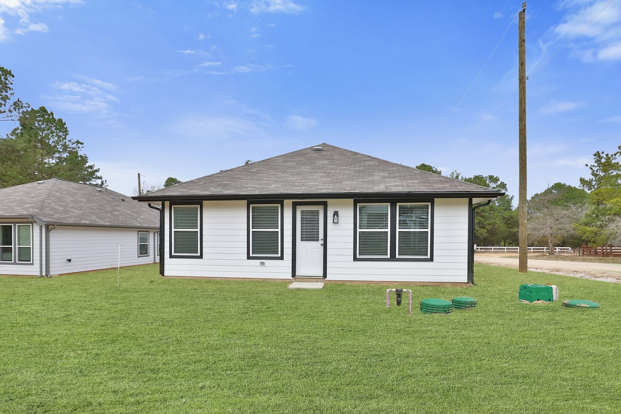 26439 Lake Shore Drive Hempstead, TX 77445 - Photo 30 of 45 a front view of a house with a yard and garage