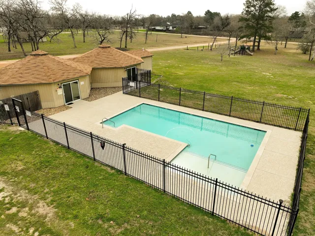 a view of a swimming pool with an ocean view