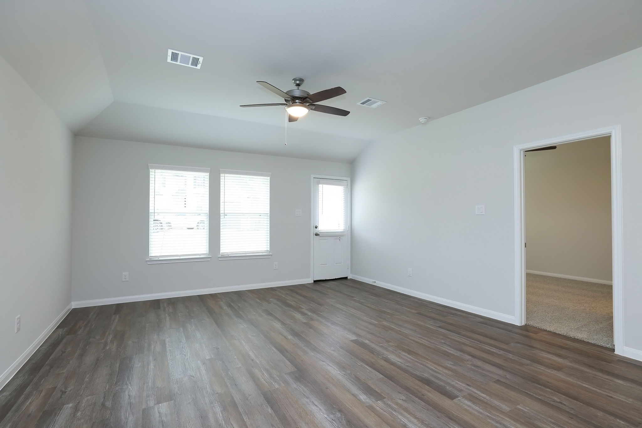 26439 Lake Shore Drive Hempstead, TX 77445 - Photo 10 of 45 a view of empty room with wooden floor and fan