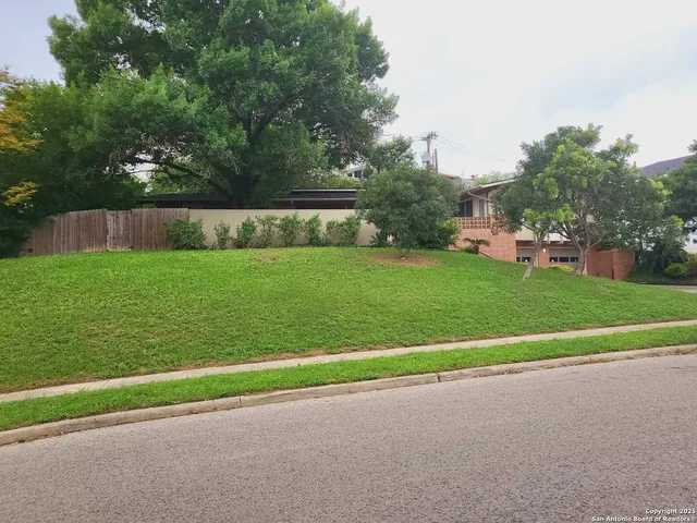 a view of a garden and basketball court